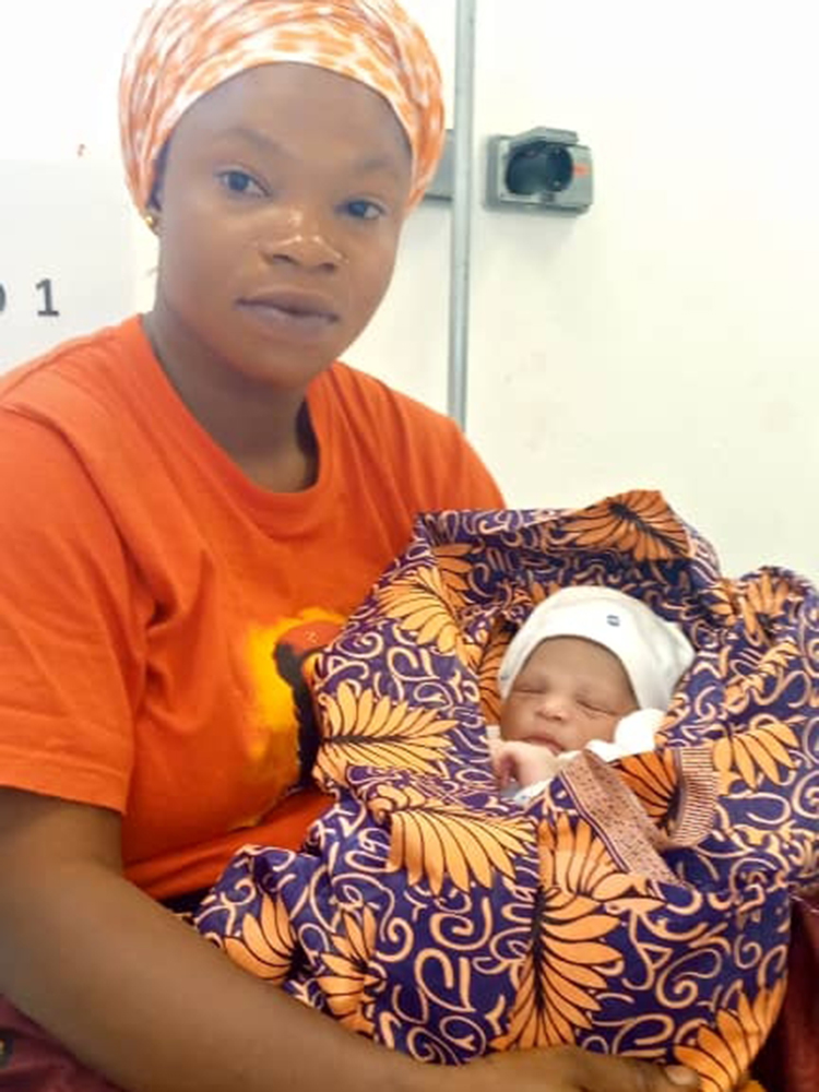 Baby Kamara and their mother at MSF's Mother and Child Hospital in Hangha